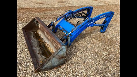 new holland skid steer bucket up|new holland 16la loader bucket.